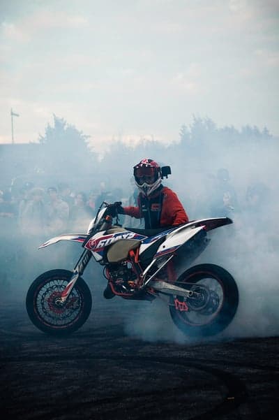 Motorcyclist Performs Wheelie in Thick Smoke