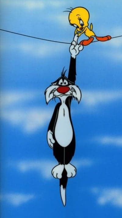 Sylvester Cat hangs precariously with Tweety Bird