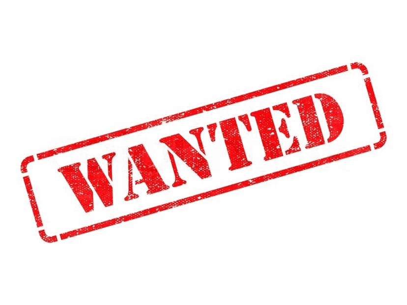 Red wanted sign circular stamp features distressed textures and bold block lettering on a transparent background.
