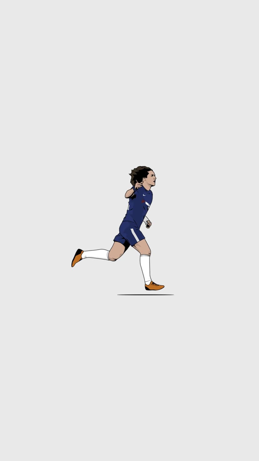 Eden Hazard runs mid-stride wearing a dark blue jersey and bright orange cleats against a plain grey backdrop.
