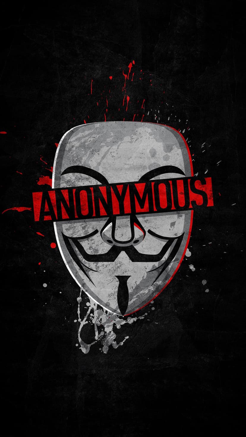Guy Fawkes mask with red Anonymous text over the eyes and crimson paint splatters on a dark textured surface.