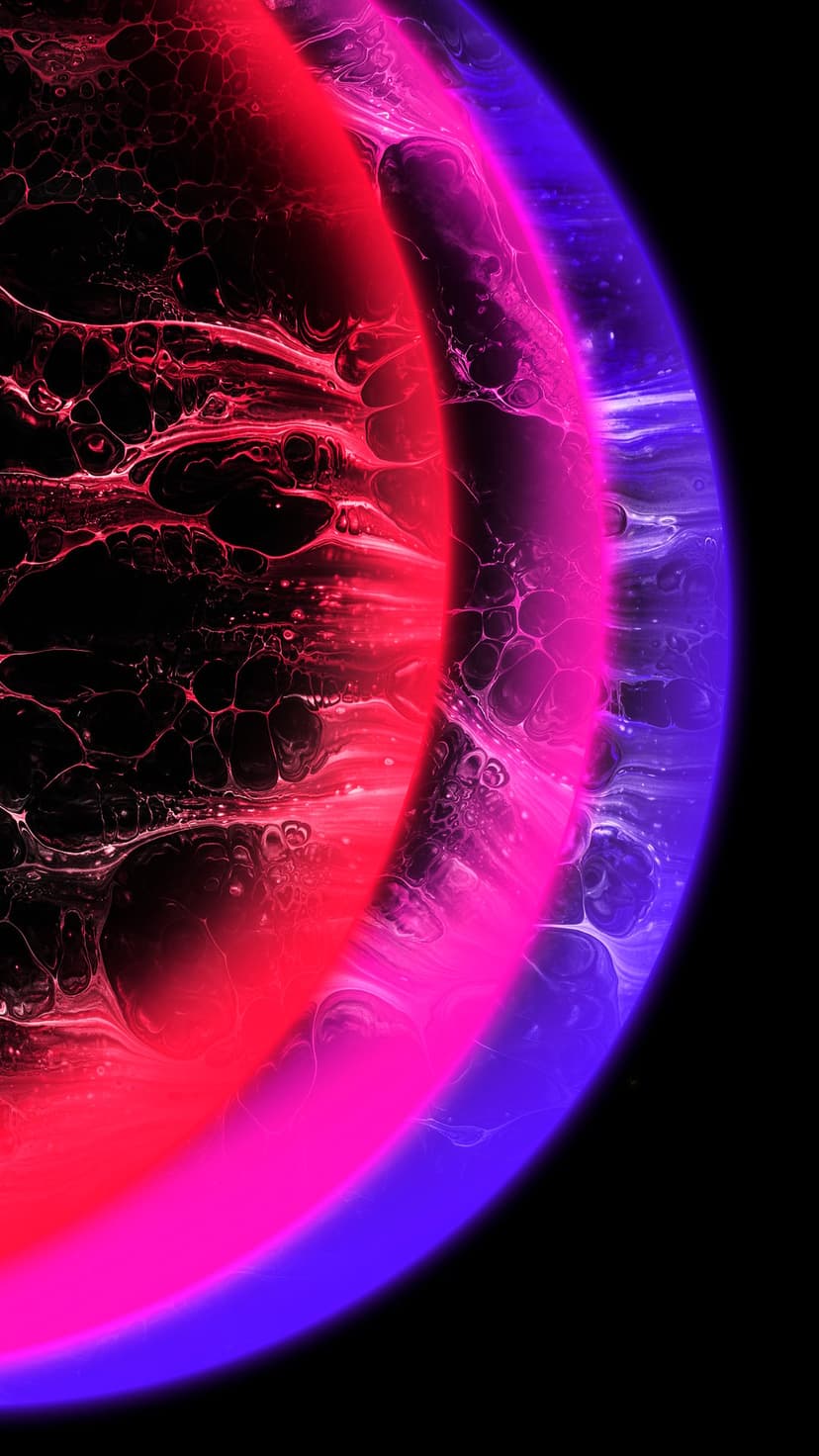 Crimson and cobalt gas clouds swirl in a dark cosmic void, creating a luminous deep space nebula background.