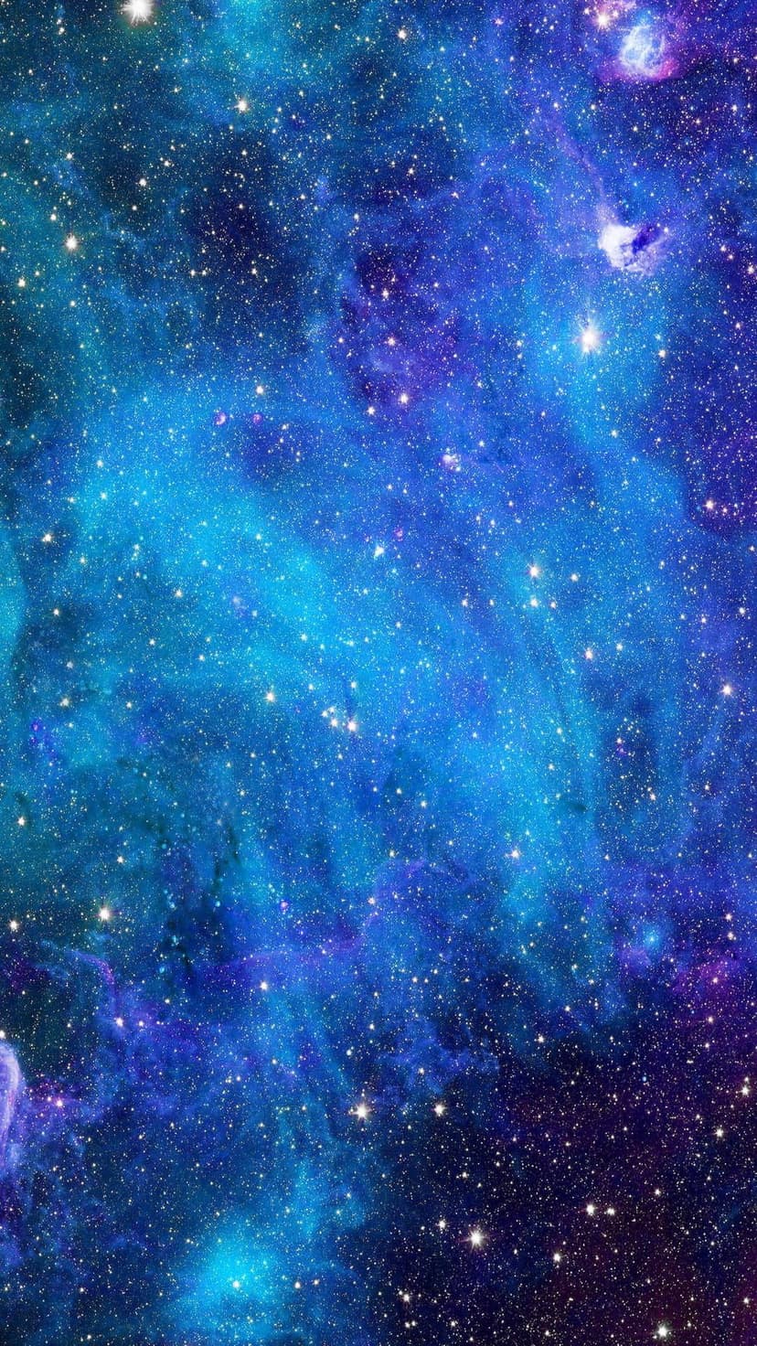 Swirling clouds of blue and purple interstellar gas are filled with countless glowing white stars and constellations.