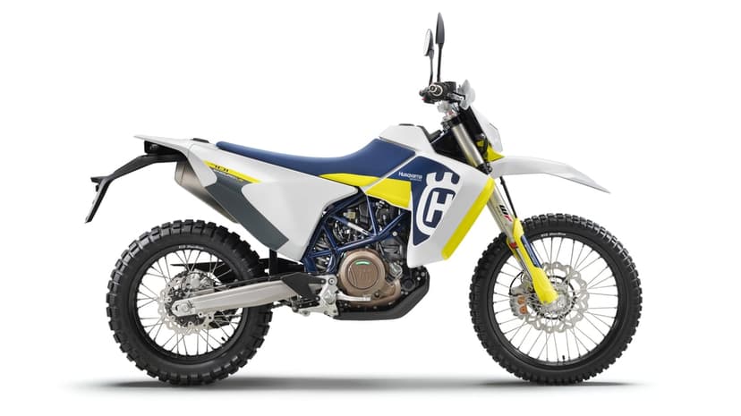 Husqvarna 701 Enduro LR motorcycle with white bodywork and knobby tires shown in profile against a white backdrop.