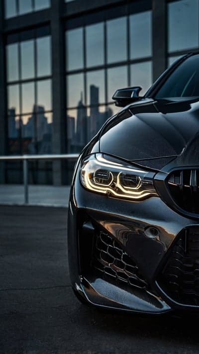 Dark BMW M3 Sport Grille and LED Headlight Phone Background