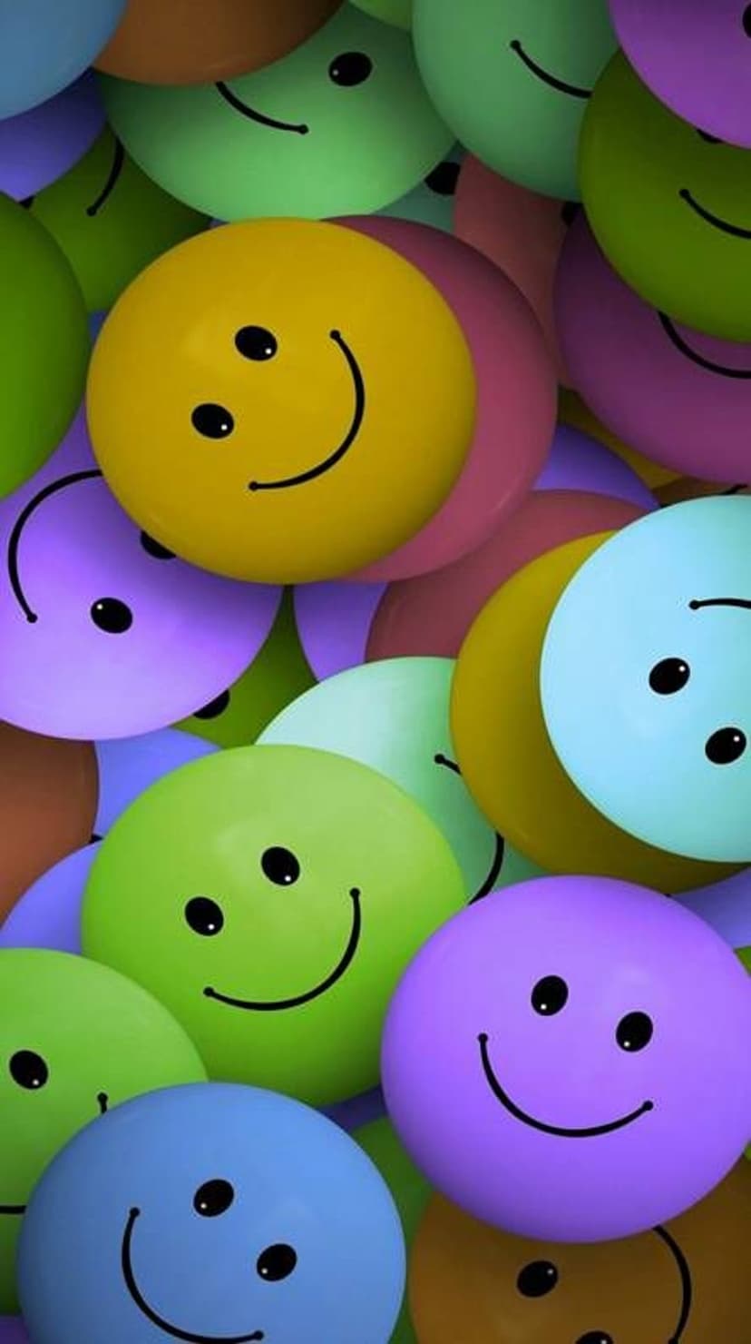 Smiling 3D spheres in pastel yellow, blue, and purple hues create a crowded and cheerful vertical composition.
