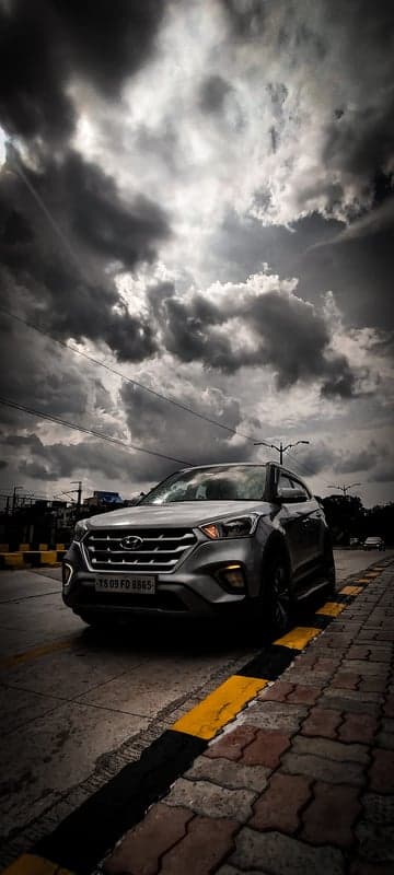 Dramatic Storm Cloud SUV Automotive Phone Wallpaper
