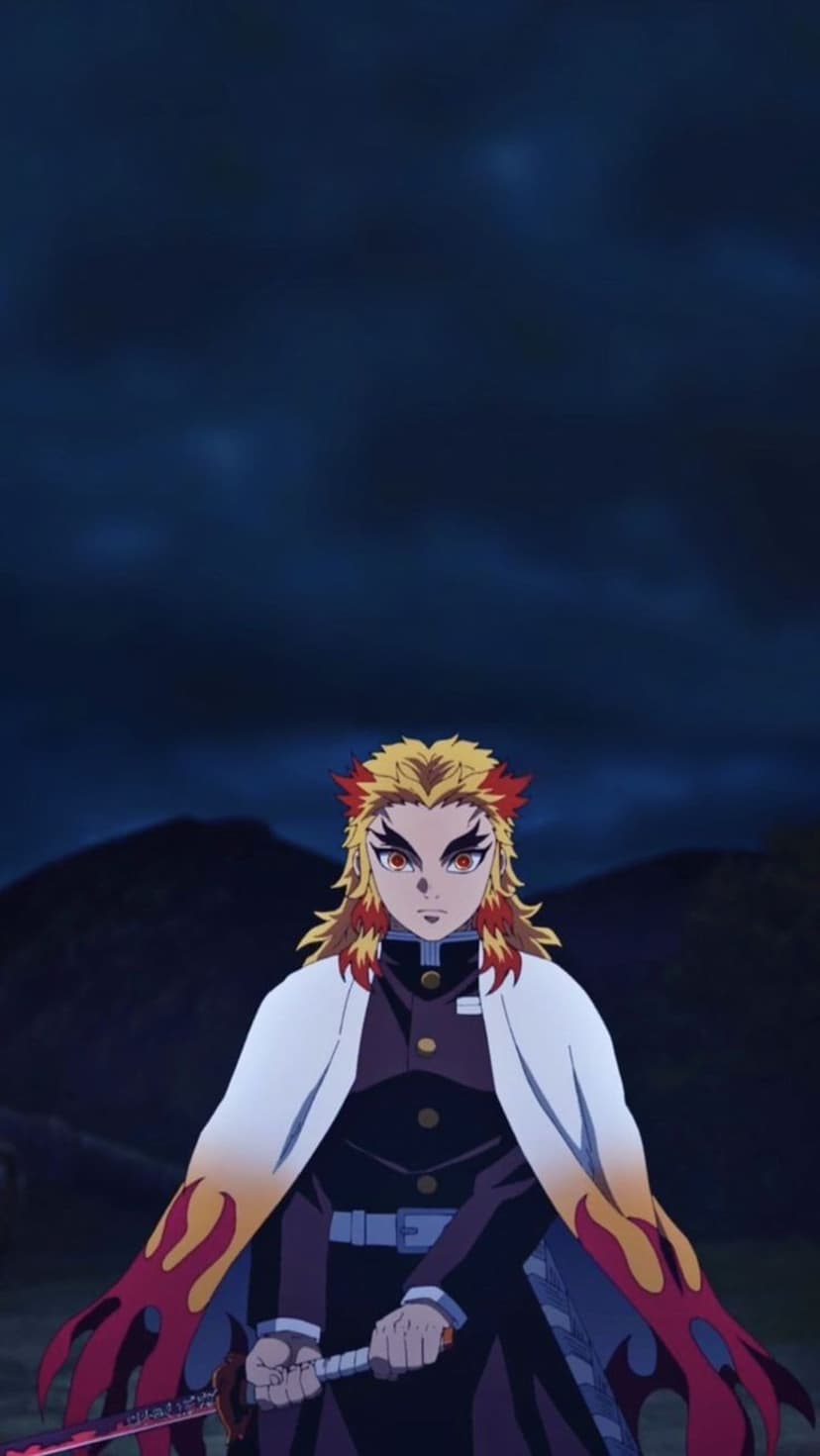 Kyojuro Rengoku holds his katana while his flame haori flows against a dark mountainous landscape at night.