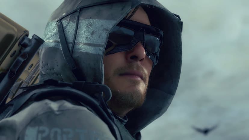 Sam Porter Bridges in a weathered grey hood and dark goggles against a misty, overcast cinematic background.