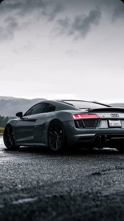Audi R8 Rear Taillights on Rainy Road Mobile Wallpaper