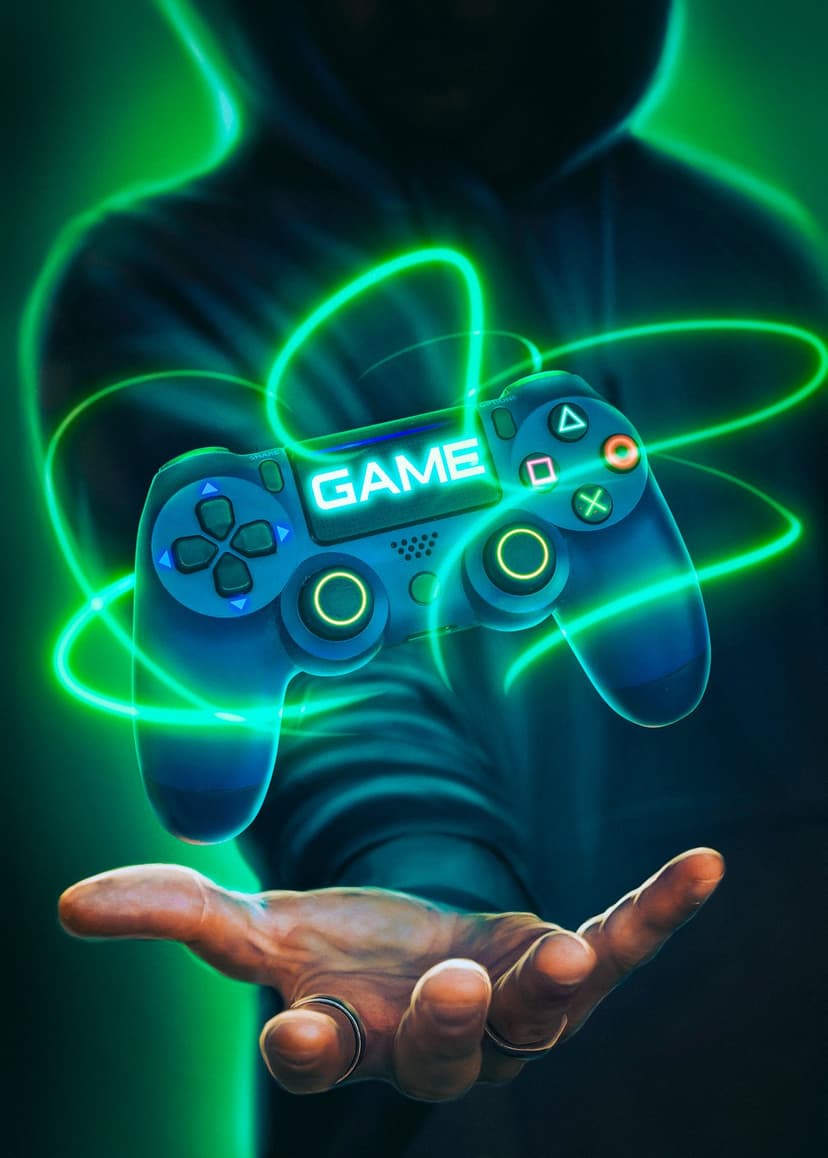 Gamer's hand holding a glowing blue controller with neon game text and swirling emerald green energy trails.