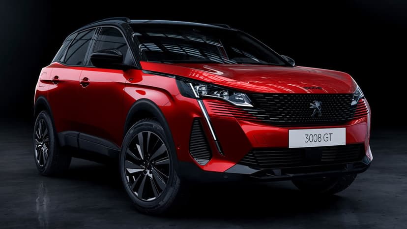 Red Peugeot 3008 GT SUV in a dark studio with bright LED headlights and reflective metallic paint finish.