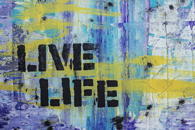 Stencil text spelling Live Life sits atop a textured blue and yellow abstract painting with thick brushstrokes.