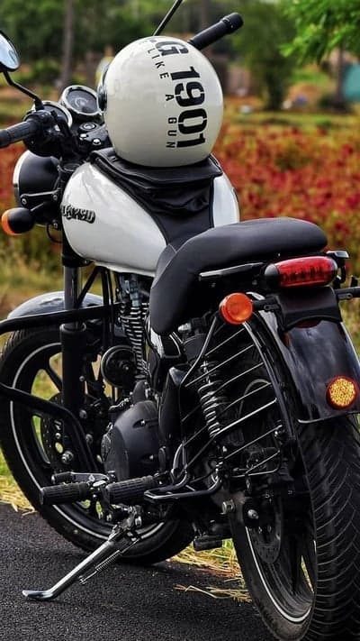 Classic Royal Enfield motorcycle with vintage helmet