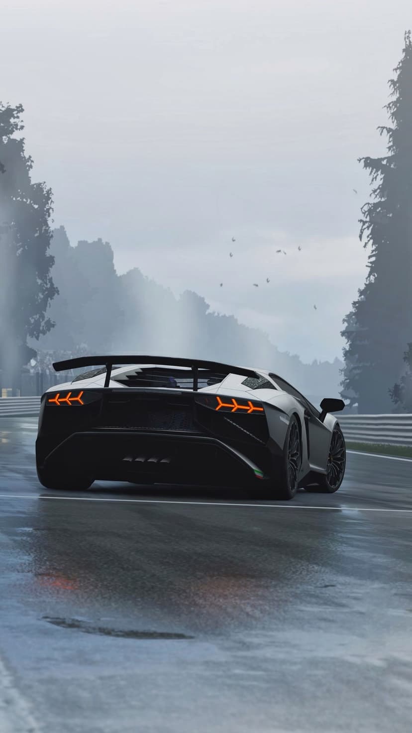 Black Lamborghini Aventador with glowing orange taillights driving on a misty rain-slicked race track at dusk.