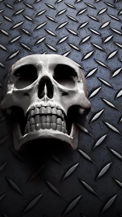 Gritty Chrome Skull on Industrial Metal Tablet Background