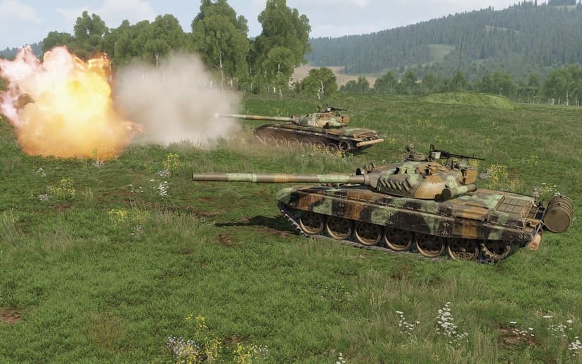 Two T-72 tanks in a green field, one firing with a large fireball and smoke cloud under a bright sky.
