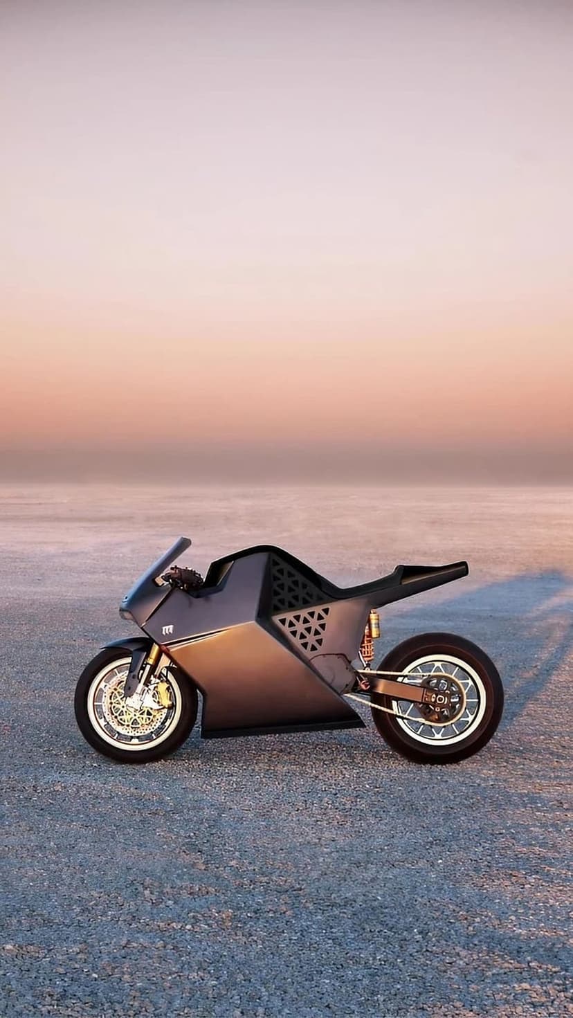 Dark grey electric motorcycle with angular geometric cutouts parked on a gravel plain under a gradient sky.