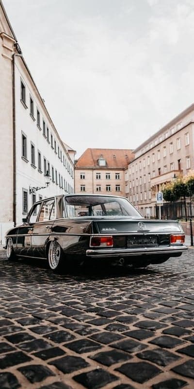 Classic Mercedes 280SE on Cobblestone Street