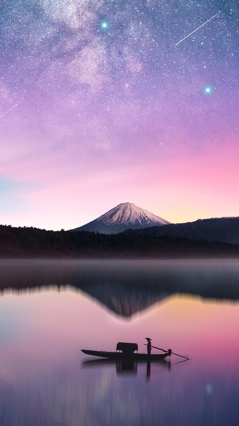 Lone person in a rowboat on a still lake reflecting a snow-capped volcano under a purple starlit night sky.