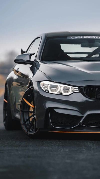 Dark Grey BMW M4 Coupe with Orange Trim Phone Wallpaper