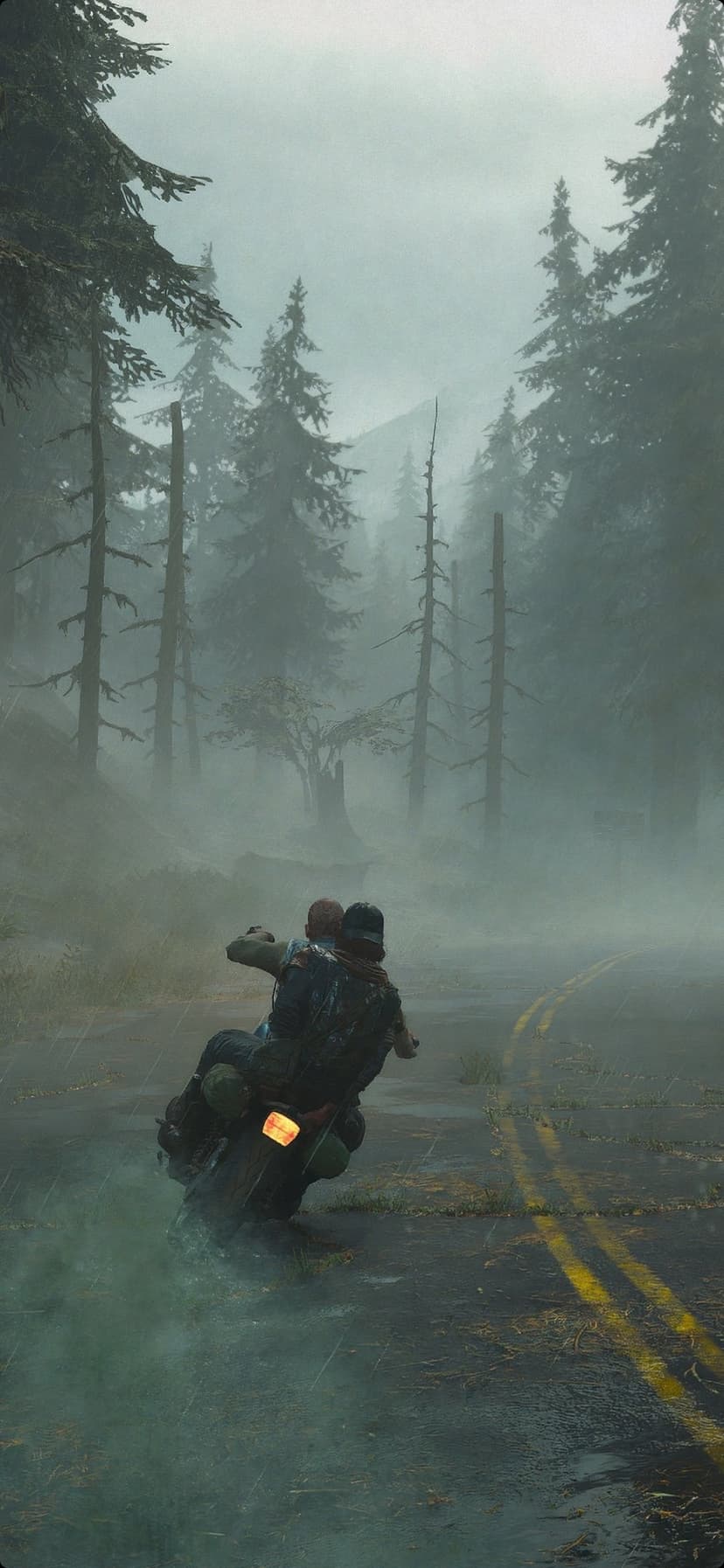 Man and woman ride a vintage motorcycle down a foggy asphalt road lined with tall trees in a gloomy forest.