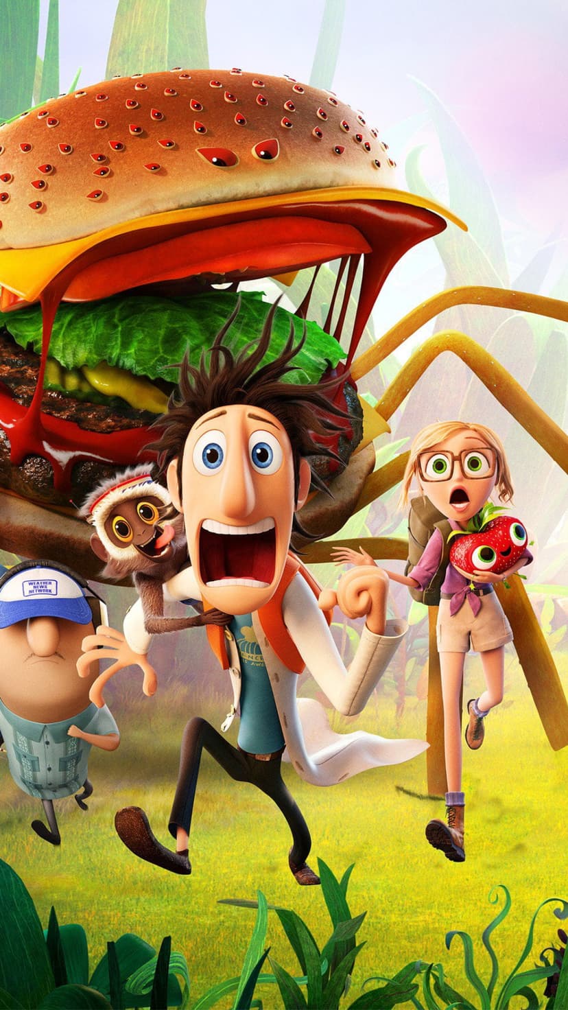 Flint Lockwood and Sam Sparks run away from a giant, angry hamburger with sharp lettuce teeth and glowing eyes.