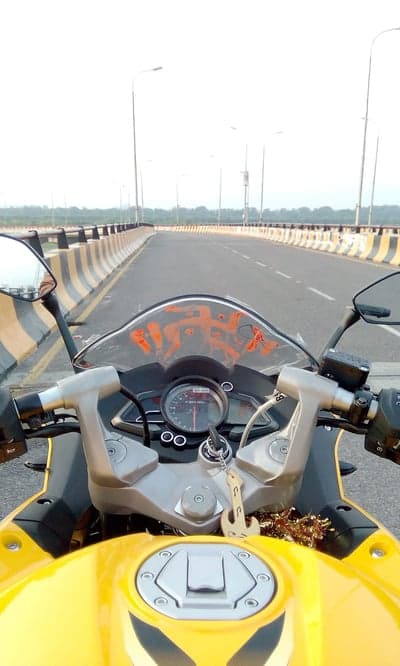 First-Person Yellow Sportbike Bridge Crossing Phone Background