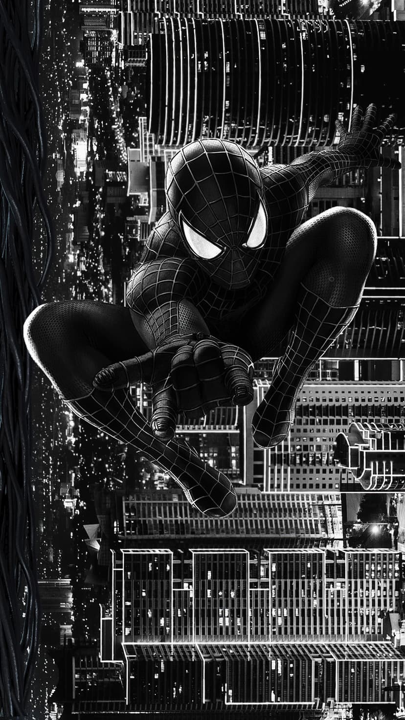 Spider-Man in a black suit leaps through a grayscale city at night with illuminated windows and skyscrapers.