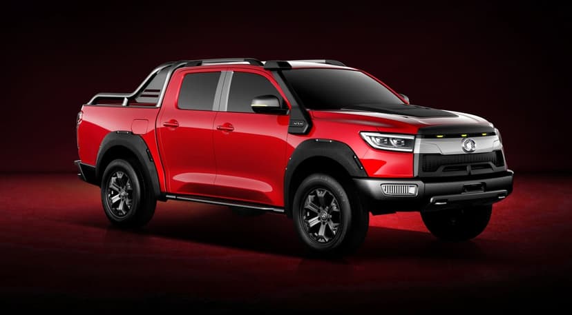 Red off-road 4x4 pickup truck with black fenders and silver roll bar against a dark red background.