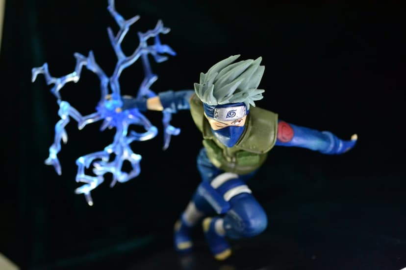 Kakashi Hatake stands in a dynamic pose with electric blue lightning energy emanating from his right hand.