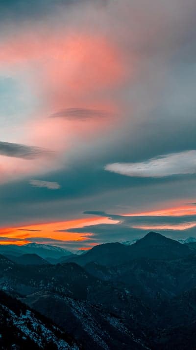 Dramatic Mountain Sunset with Pink and Orange Clouds