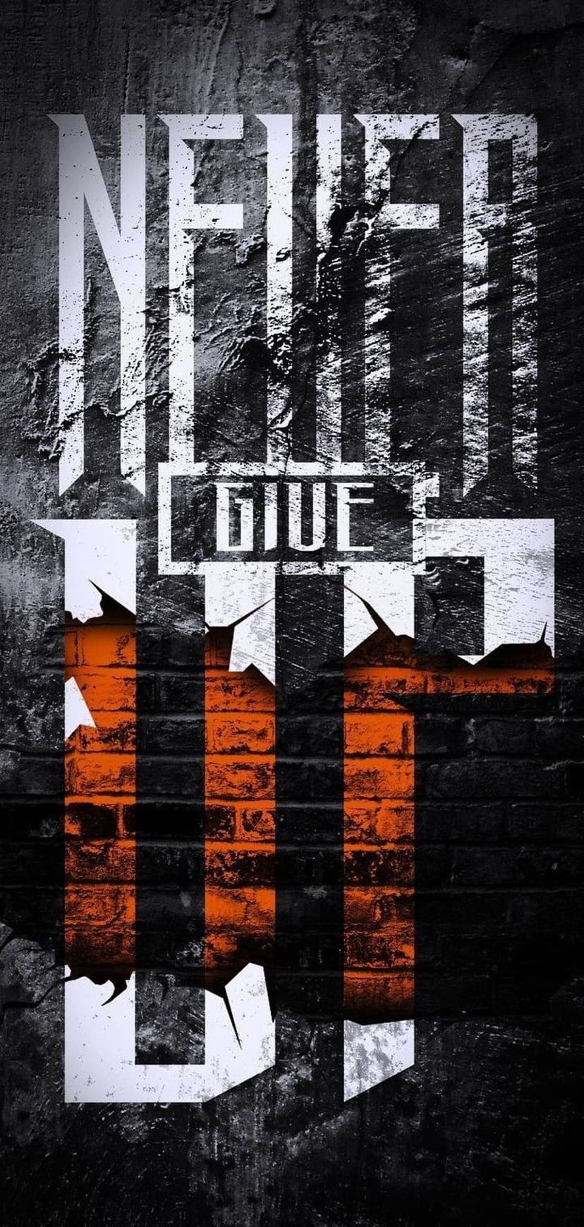 Never Give Up typography in orange and white letters centered on a textured, distressed gray brick wall surface.