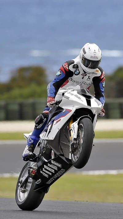Motorcycle Racer Performing Wheelie on a BMW S1000RR