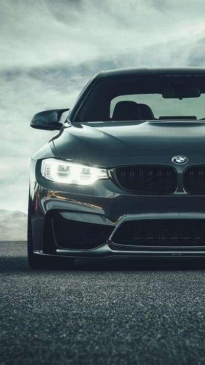 Aggressive BMW M4 Dark Gray Sportscar Mobile Background
