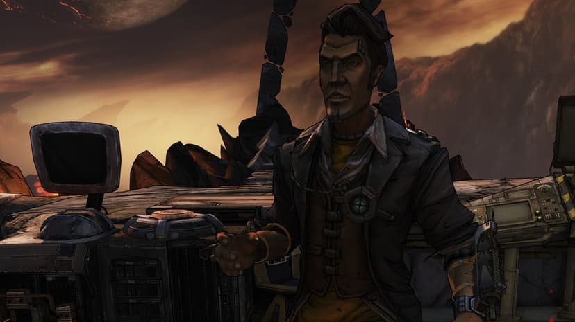 Handsome Jack stands near control monitors on a desolate volcanic planet under a large cracked moon.