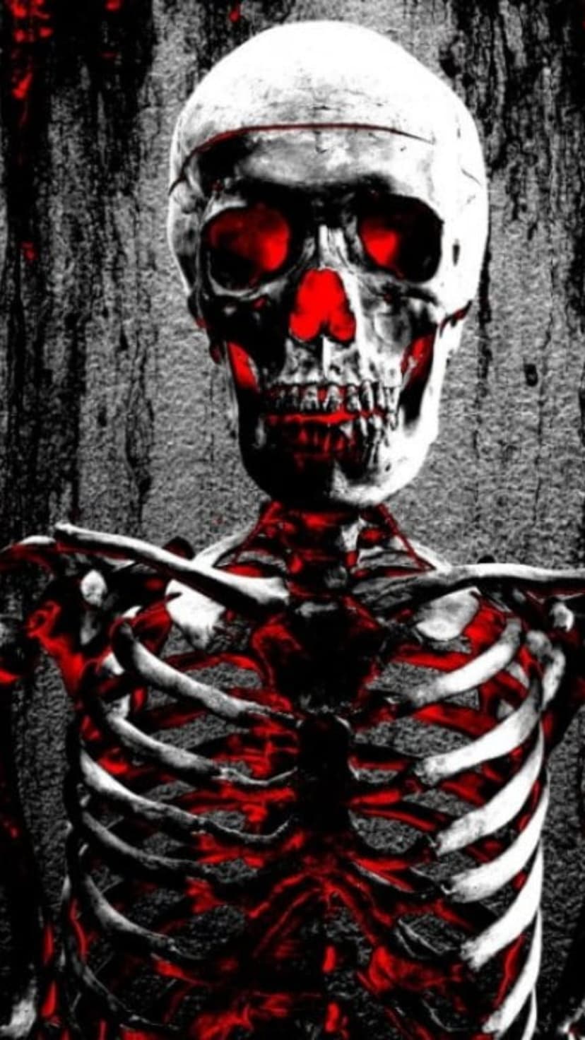 Skeletal skull with glowing red eyes and a crimson light illuminating the ribcage against a dark gray background.