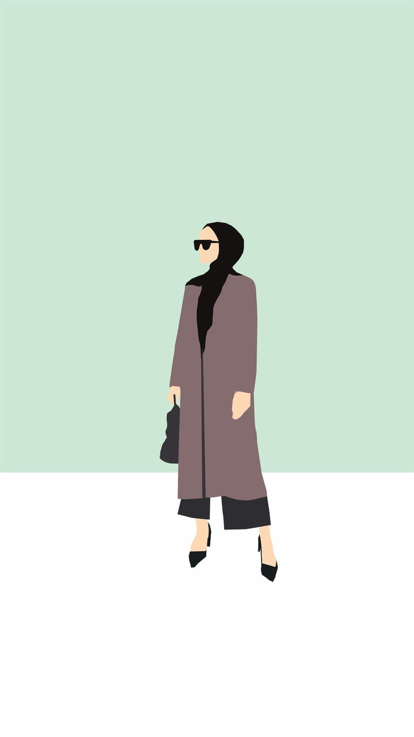 Woman in a black hijab and tan trench coat stands against a split green and white background holding a handbag.