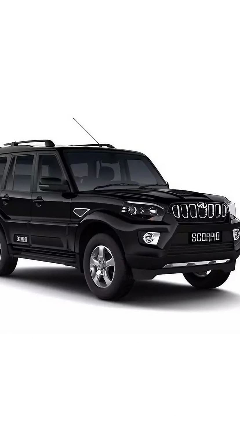 Black Mahindra Scorpio SUV with chrome grille and alloy wheels parked against a solid white studio background.