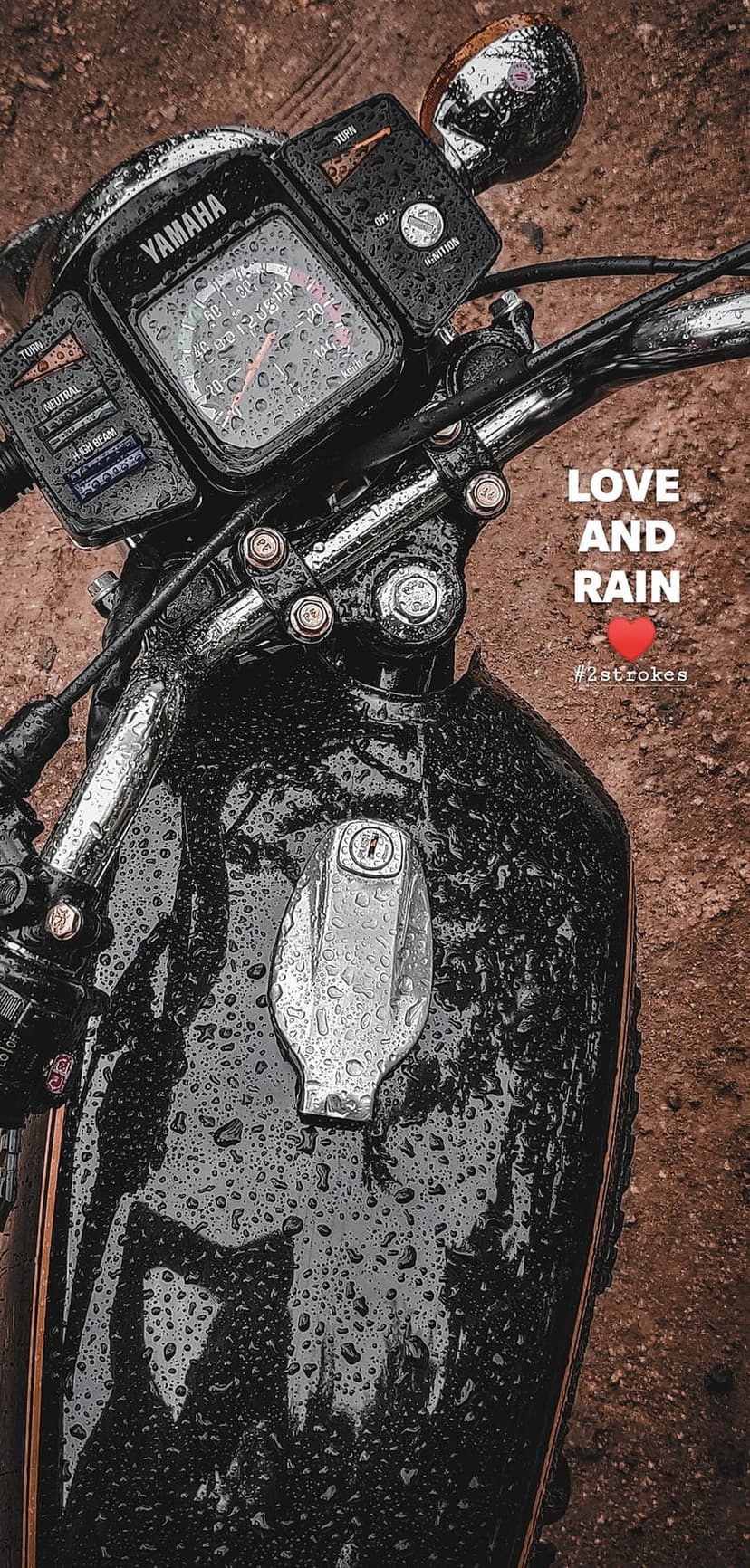 Yamaha motorcycle speedometer covered in water droplets with Love and Rain text on a brown textured background.