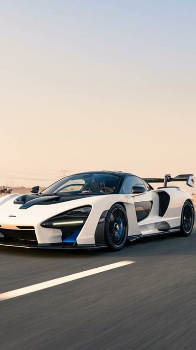 McLaren Senna Hypercar Racing Through Desert Phone Wallpaper