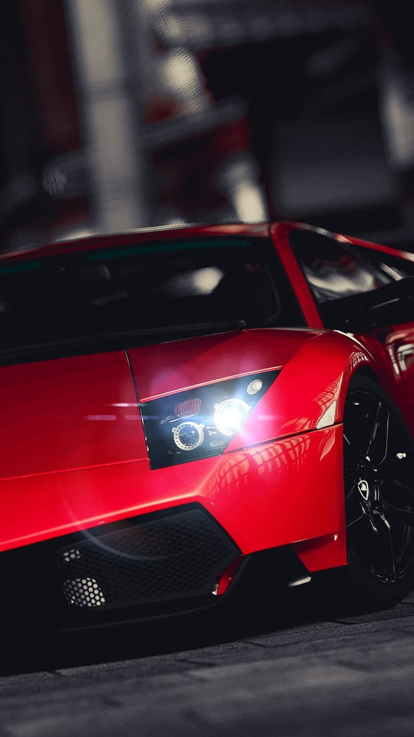 Red Lamborghini front grille and LED headlight with dramatic lighting reflections and metallic paint details.