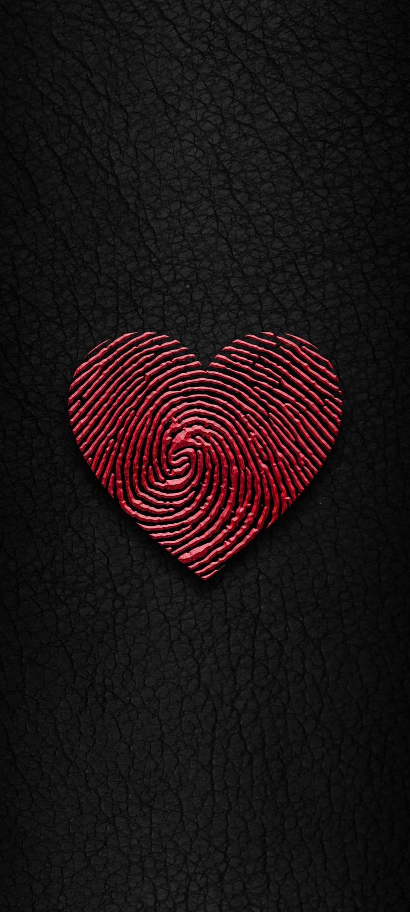Red fingerprint heart centered on a dark black leather textured background with high contrast macro details.