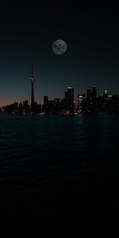 Lunar Cityscape - Moonlit Metropolis Over Dark Waters