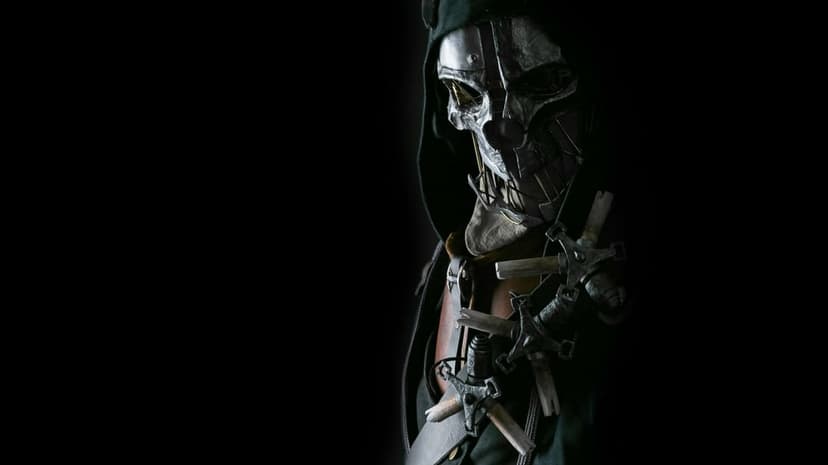Metallic skull mask and dark hood of a stealthy assassin lit from the side against a deep black background.