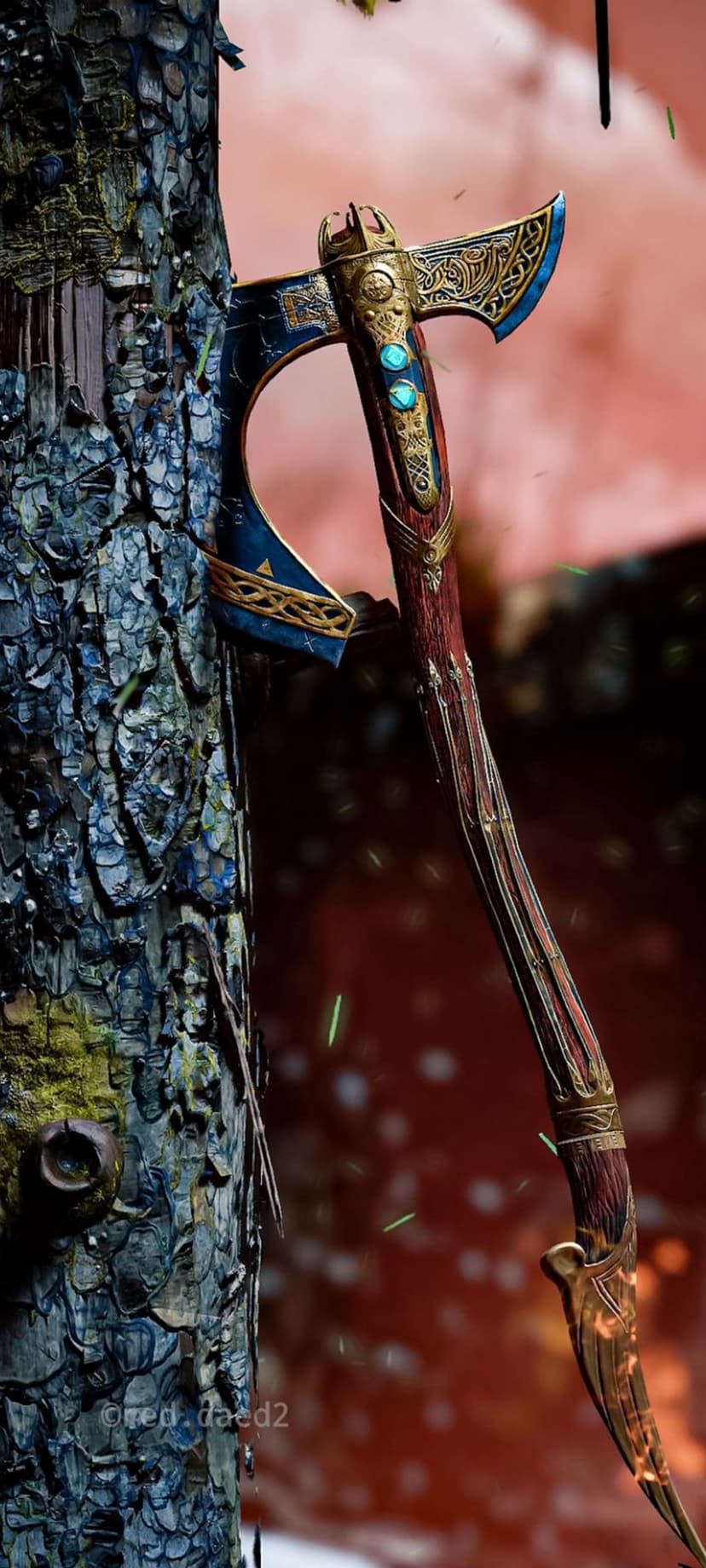 Leviathan Axe with blue gems and gold runes embedded in a mossy tree trunk amidst glowing embers and bokeh light.