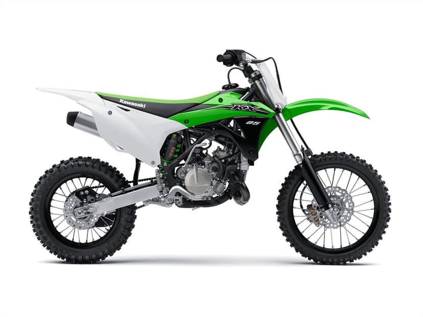 Kawasaki KX85 dirt bike side profile with lime green fairings, rugged knobby tires, and a silver engine detail.
