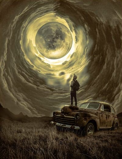 Man On Vintage Car Beneath Surreal Moon Vortex Wallpaper