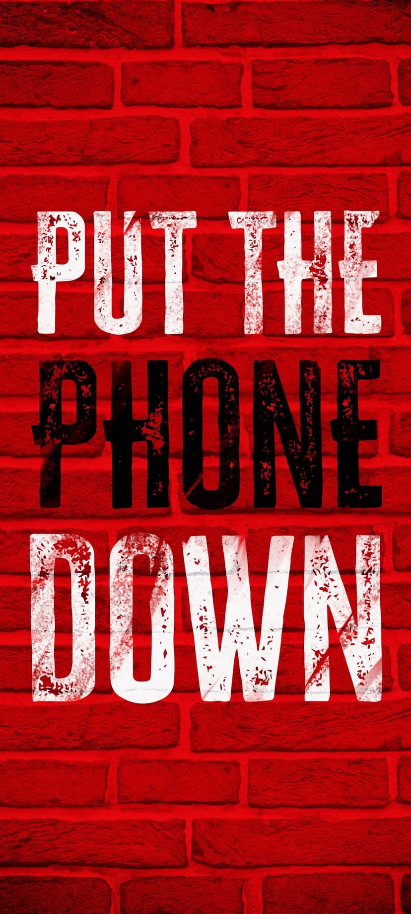 White and black block text reading PUT THE PHONE DOWN centered on a textured red brick wall background.