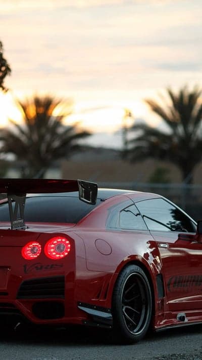 Red Nissan GT-R Rear Wing Sunset Mobile Background